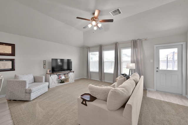 2233 Forest Chestnut Dr, Spring, TX 77386 - living room with light carpet, a ceiling fan, healthy amount of natural light, baseboards, and lofted ceiling