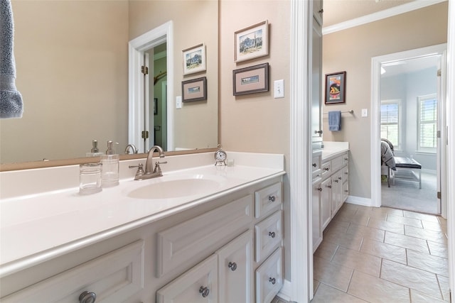 208 Canyon Oak Dr, Lake Jackson, TX 77566 - bathroom with vanity, crown molding, and baseboards