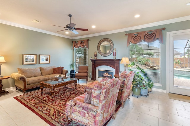 208 Canyon Oak Dr, Lake Jackson, TX 77566 - tiled living room featuring a ceiling fan, crown molding, a glass covered fireplace, baseboards, and recessed lighting