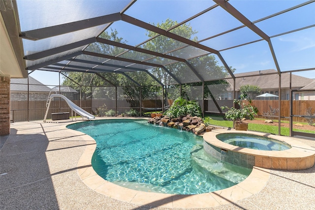 208 Canyon Oak Dr, Lake Jackson, TX 77566 - view of pool with a water slide, a pool with connected hot tub, a fenced backyard, and a lanai
