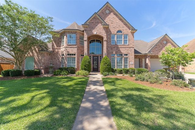 208 Canyon Oak Dr, Lake Jackson, TX 77566 - traditional-style home featuring brick siding and a front lawn