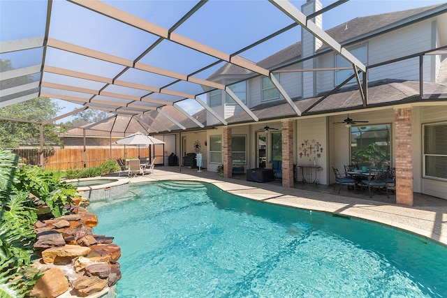 208 Canyon Oak Dr, Lake Jackson, TX 77566 - view of swimming pool with a ceiling fan, a patio area, outdoor dining area, fence, and a lanai