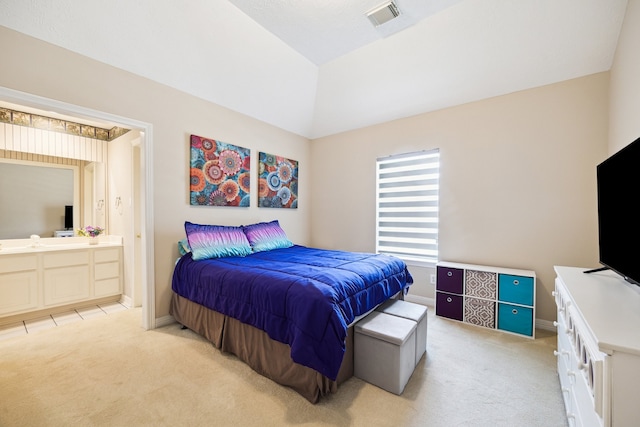 7719 Allegro Dr, Houston, TX 77040 - bedroom featuring light carpet, connected bathroom, baseboards, and lofted ceiling