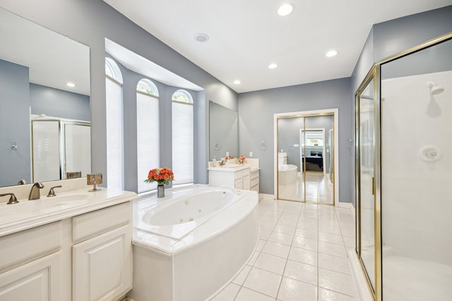 7719 Allegro Dr, Houston, TX 77040 - bathroom with a stall shower, healthy amount of natural light, tile patterned flooring, a jetted tub, and recessed lighting