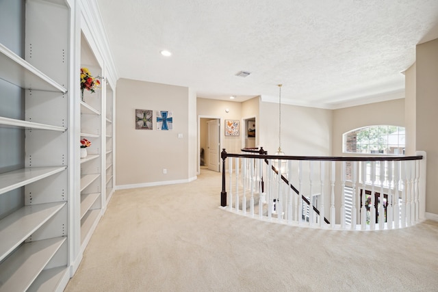 7719 Allegro Dr, Houston, TX 77040 - hall featuring carpet flooring, an upstairs landing, baseboards, and recessed lighting