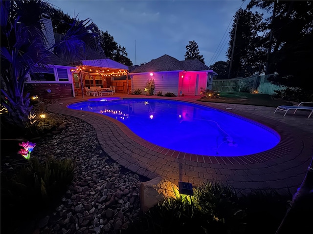 7719 Allegro Dr, Houston, TX 77040 - view of swimming pool featuring fence, a patio area, and an outdoor structure