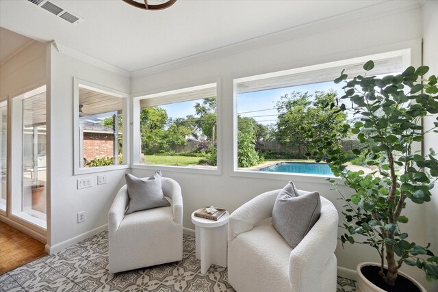 1415 Lehman St, Houston, TX 77018 - sunroom with healthy amount of natural light, baseboards, and crown molding