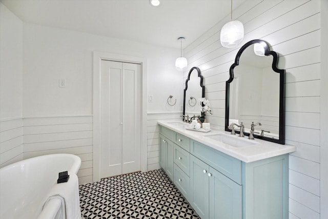 1415 Lehman St, Houston, TX 77018 - bathroom with double vanity, a freestanding tub, a wainscoted wall, wooden walls, and tile patterned floors