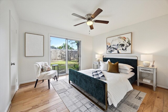 1415 Lehman St, Houston, TX 77018 - bedroom with access to exterior, light wood-style floors, a ceiling fan, and baseboards