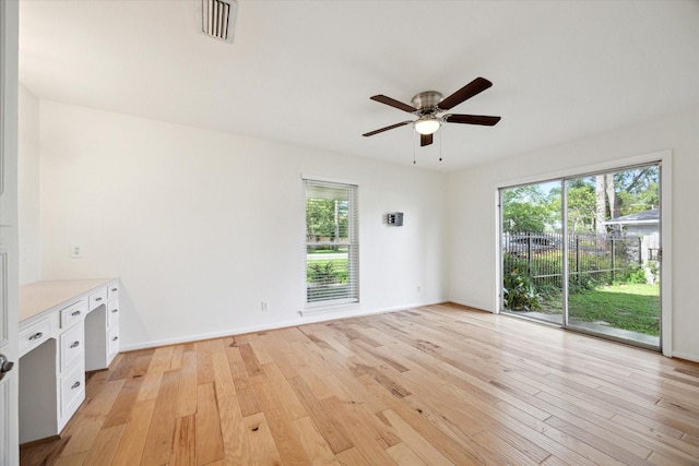 1415 Lehman St, Houston, TX 77018 - unfurnished living room with a ceiling fan, light wood-type flooring, and baseboards