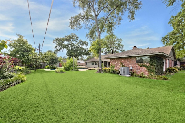 1415 Lehman St, Houston, TX 77018 - view of green lawn featuring central AC and a pool
