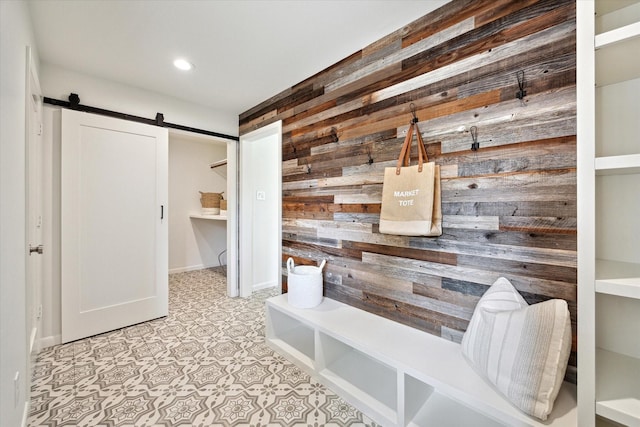 1415 Lehman St, Houston, TX 77018 - mudroom with wooden walls, a barn door, and recessed lighting