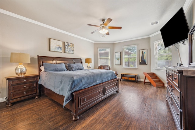 802 Fairway Dr, La Porte, TX 77571 - bedroom with dark wood-type flooring, crown molding, baseboards, and ceiling fan