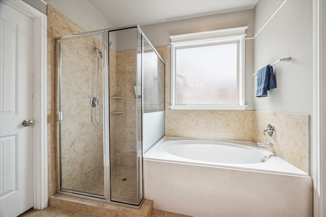 802 Fairway Dr, La Porte, TX 77571 - full bathroom with a stall shower, a garden tub, and tile patterned floors