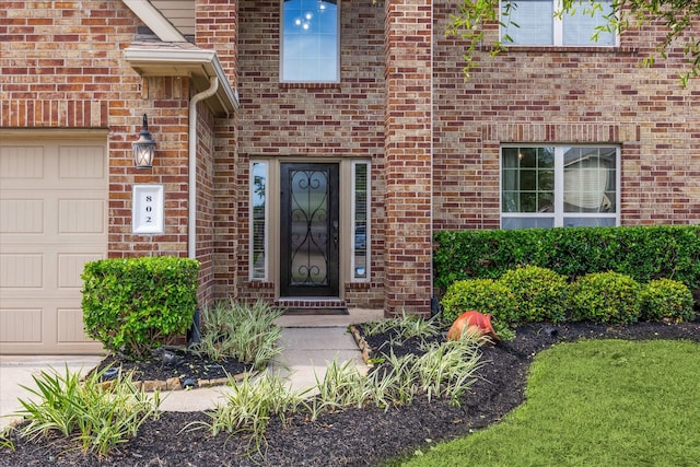 802 Fairway Dr, La Porte, TX 77571 - entrance to property featuring an attached garage and brick siding