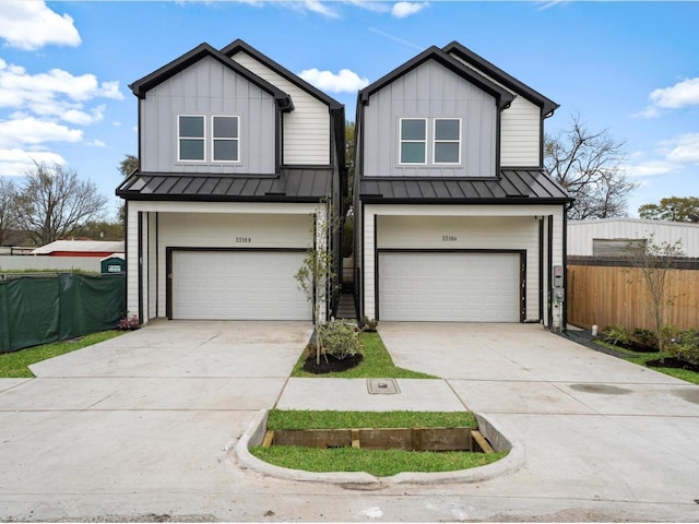 5518 Cortlandt St Unit A, Houston, TX 77076 - view of front of property with a standing seam roof, fence, an attached garage, and board and batten siding