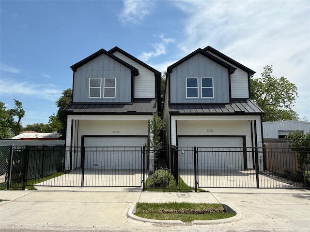 5518 Cortlandt St Unit A, Houston, TX 77076 - view of front facade featuring an attached garage, a standing seam roof, and driveway