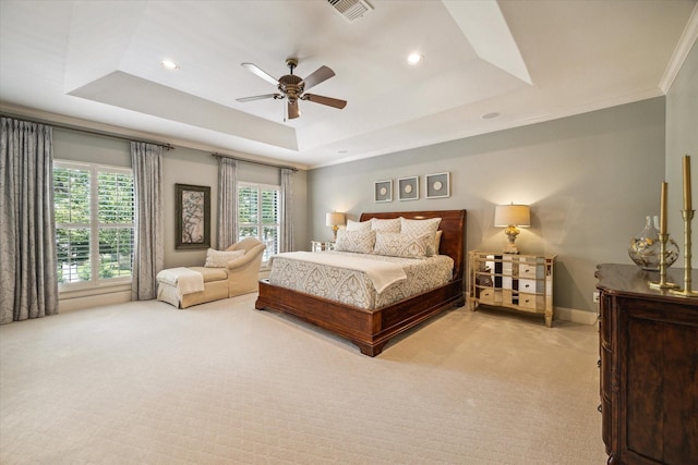 4504 Birch St, Bellaire, TX 77401 - bedroom featuring a tray ceiling, light colored carpet, multiple windows, crown molding, and recessed lighting