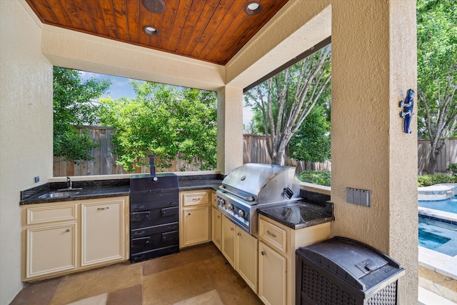 4504 Birch St, Bellaire, TX 77401 - view of patio / terrace with a grill, a fenced backyard, a sink, and area for grilling