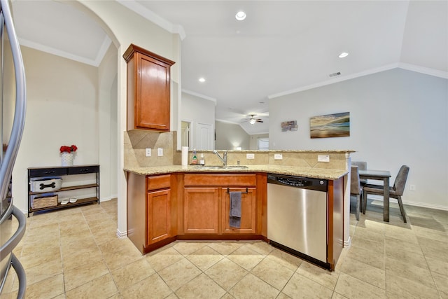 kitchen featuring appliances with stainless steel finishes, a sink, tasteful backsplash, a peninsula, and recessed lighting