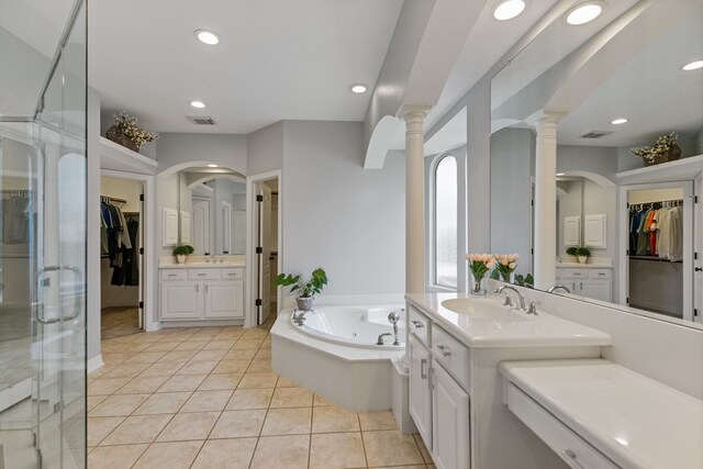 13911 Falcon Heights Dr, Cypress, TX 77429 - full bath with tile patterned floors, a tub with jets, ornate columns, a spacious closet, and recessed lighting