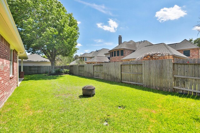 13911 Falcon Heights Dr, Cypress, TX 77429 - view of yard with a fire pit