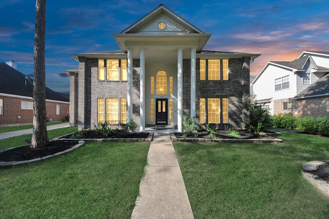 22611 Bucktrout Ln, Katy, TX 77449 - neoclassical home featuring brick siding and a yard