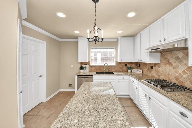 22611 Bucktrout Ln, Katy, TX 77449 - kitchen with stainless steel appliances, under cabinet range hood, a sink, light tile patterned flooring, and crown molding