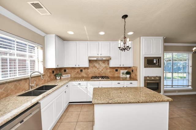 22611 Bucktrout Ln, Katy, TX 77449 - kitchen featuring stainless steel appliances, a sink, a chandelier, light tile patterned floors, and crown molding