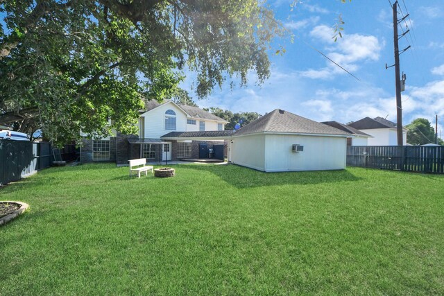 22611 Bucktrout Ln, Katy, TX 77449 - view of yard featuring an outdoor fire pit