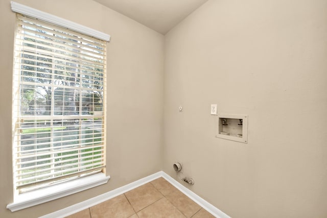22611 Bucktrout Ln, Katy, TX 77449 - washroom featuring light tile patterned flooring, baseboards, hookup for an electric dryer, and washer hookup