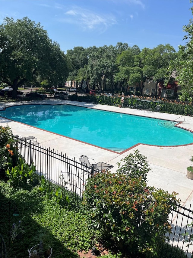 5207 Arboles Dr Unit 3, Houston, TX 77035 - community pool with fence, a patio area, and view of wooded area