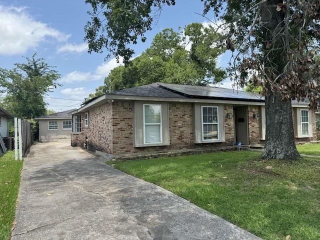 11111 Sagecrest Ln, Houston, TX 77089 - ranch-style house with a front yard, solar panels, brick siding, and concrete driveway