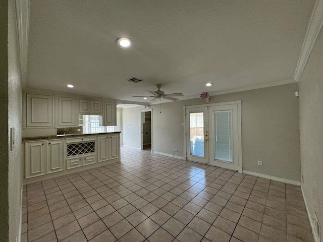 11111 Sagecrest Ln, Houston, TX 77089 - unfurnished living room with ornamental molding, baseboards, ceiling fan, light tile patterned flooring, and french doors