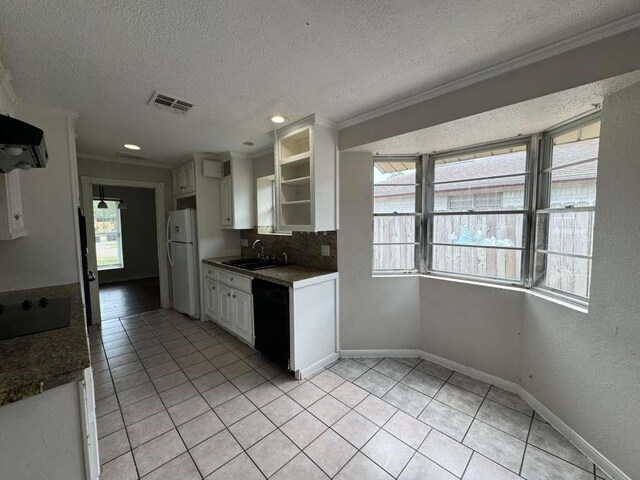 11111 Sagecrest Ln, Houston, TX 77089 - kitchen with black appliances, crown molding, open shelves, a textured ceiling, and light tile patterned floors
