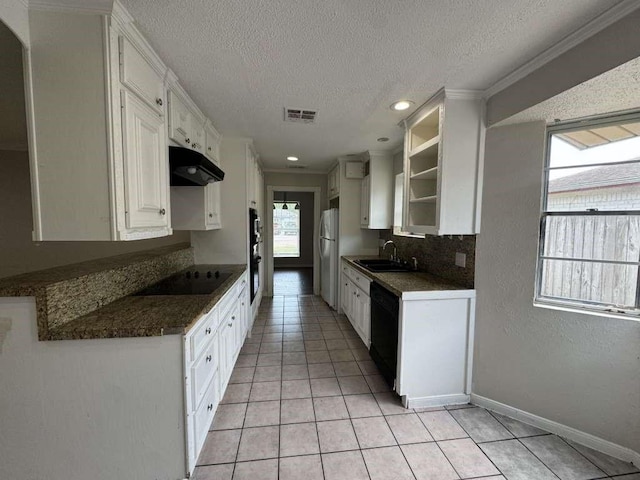11111 Sagecrest Ln, Houston, TX 77089 - kitchen featuring black appliances, under cabinet range hood, dark countertops, a sink, and a textured ceiling