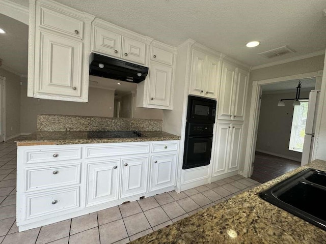 11111 Sagecrest Ln, Houston, TX 77089 - kitchen with black appliances, under cabinet range hood, crown molding, white cabinetry, and light tile patterned flooring