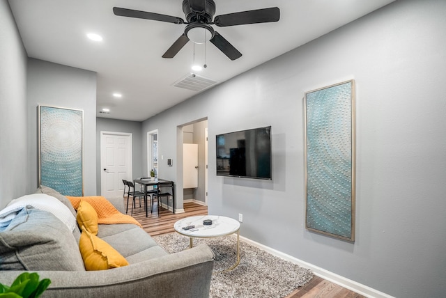 3409 Providence St, Houston, TX 77020 - living room with wood finished floors, baseboards, a ceiling fan, and recessed lighting