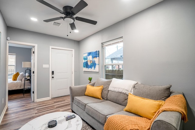 3409 Providence St, Houston, TX 77020 - living area featuring wood finished floors, ceiling fan, baseboards, and recessed lighting