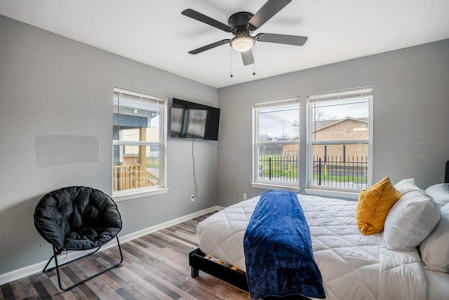3409 Providence St, Houston, TX 77020 - bedroom featuring baseboards, wood finished floors, and ceiling fan