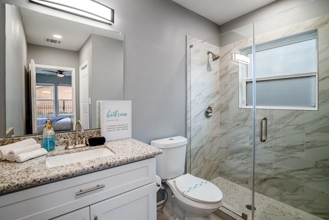 3409 Providence St, Houston, TX 77020 - ensuite bathroom featuring toilet, a stall shower, vanity, and ceiling fan