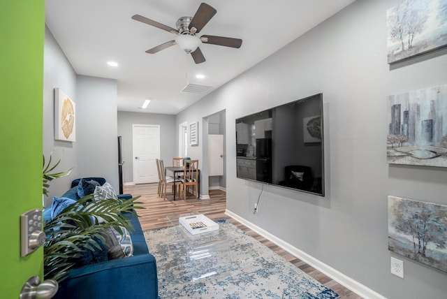 3409 Providence St, Houston, TX 77020 - living area with wood finished floors, a ceiling fan, baseboards, and recessed lighting