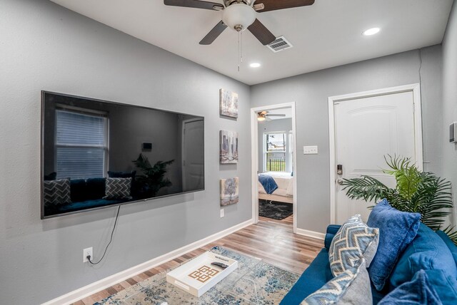 3409 Providence St, Houston, TX 77020 - living room with ceiling fan, wood finished floors, baseboards, and recessed lighting