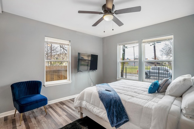 3409 Providence St, Houston, TX 77020 - bedroom featuring baseboards, wood finished floors, and a ceiling fan