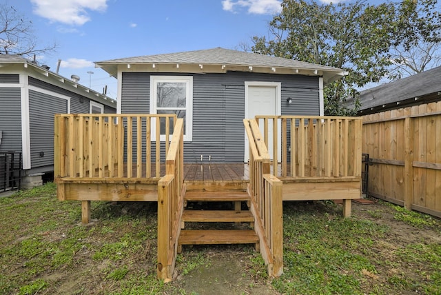 3409 Providence St, Houston, TX 77020 - rear view of house featuring fence, a deck, and a shingled roof