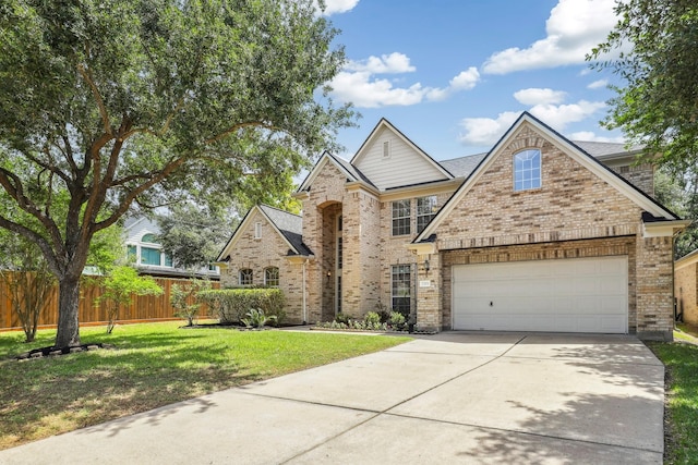 2203 Centerbrook Ln, Katy, TX 77450 - traditional-style house featuring brick siding, concrete driveway, and an attached garage