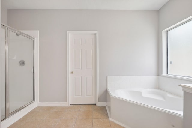 2203 Centerbrook Ln, Katy, TX 77450 - full bath with a stall shower, a bath, tile patterned flooring, and baseboards