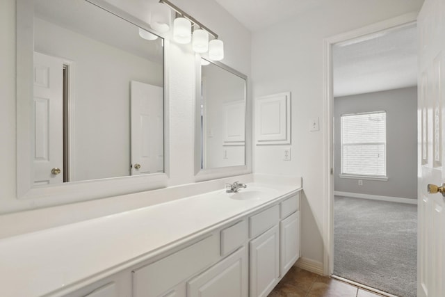 2203 Centerbrook Ln, Katy, TX 77450 - bathroom with baseboards, vanity, and tile patterned floors
