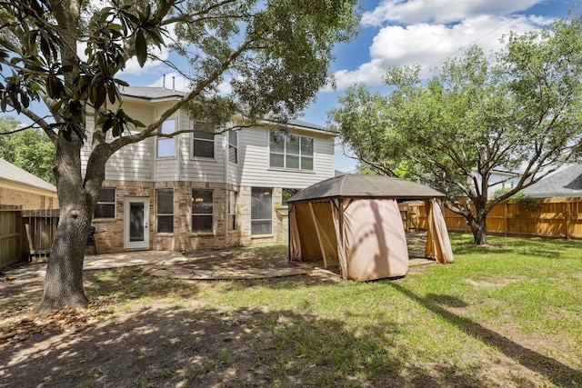 2203 Centerbrook Ln, Katy, TX 77450 - rear view of property with a gazebo, brick siding, and a patio area
