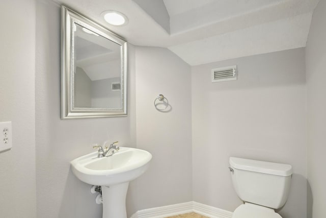 2203 Centerbrook Ln, Katy, TX 77450 - half bathroom with vaulted ceiling, toilet, and baseboards